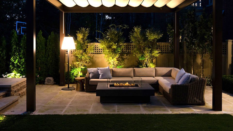 patio with fire pit at night