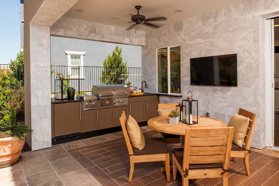 outdoor kitchen and dining area