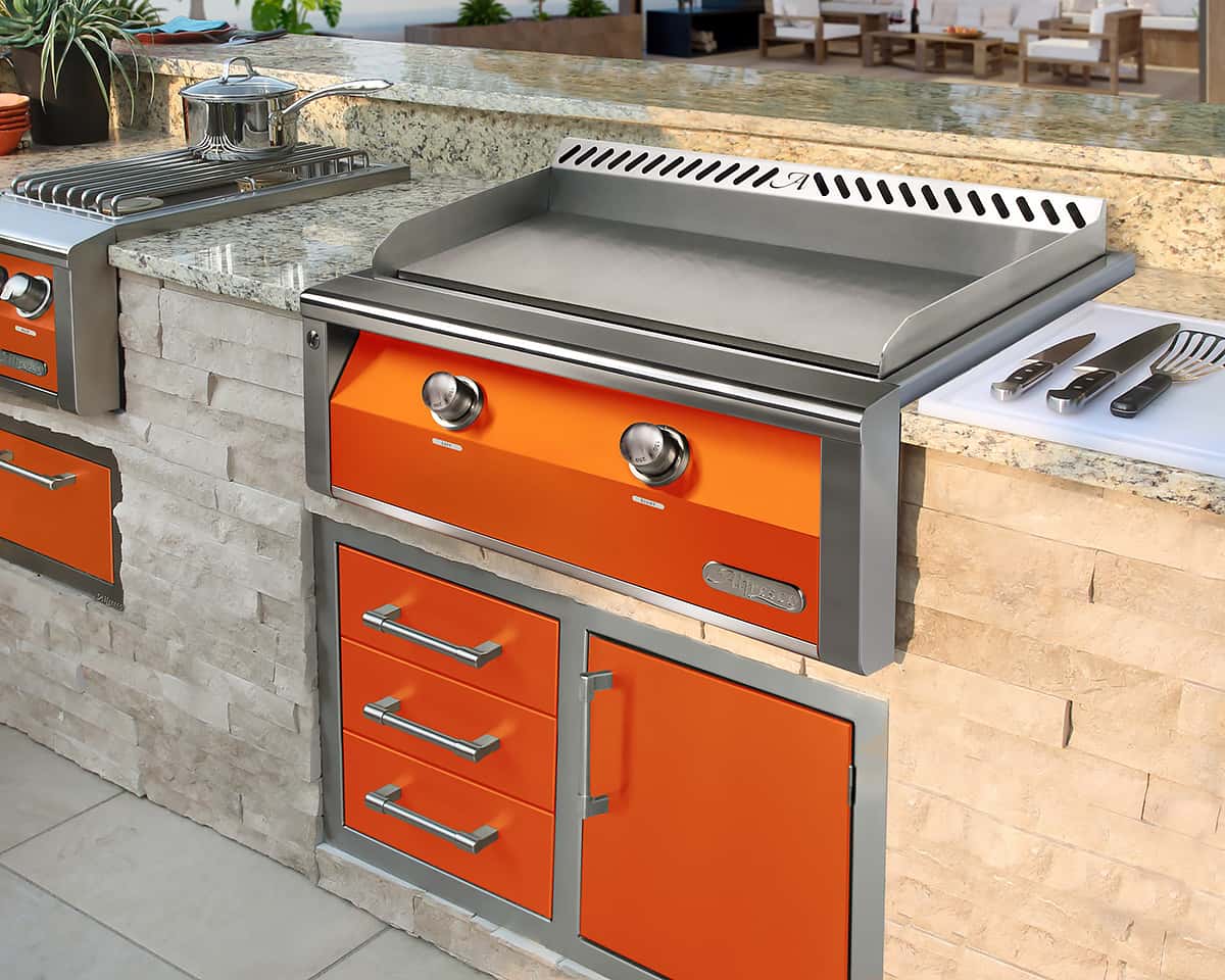 built-in outdoor griddle with orange accent color