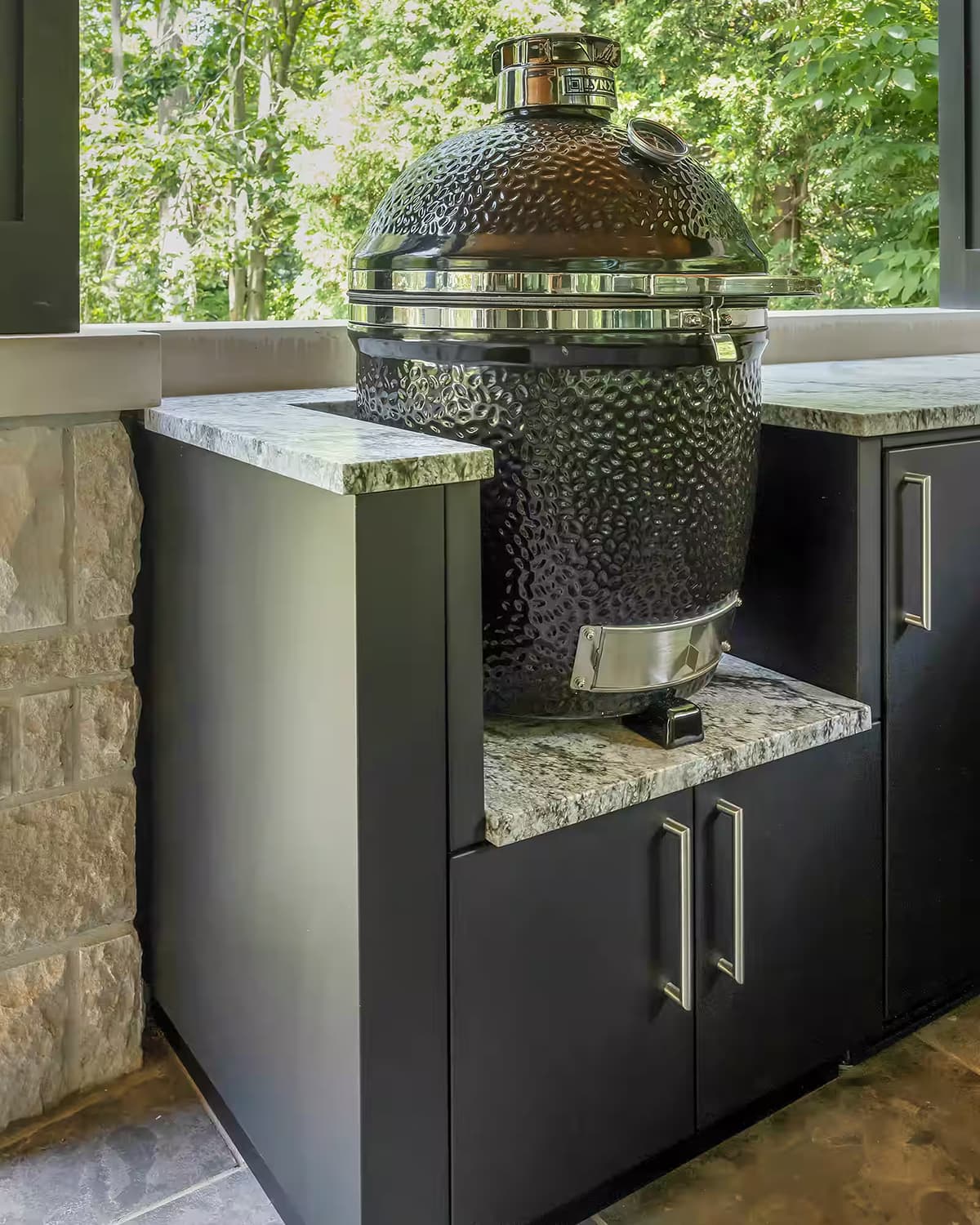 Lynx Kamado ceramic grill supported by Alumina cabinetry