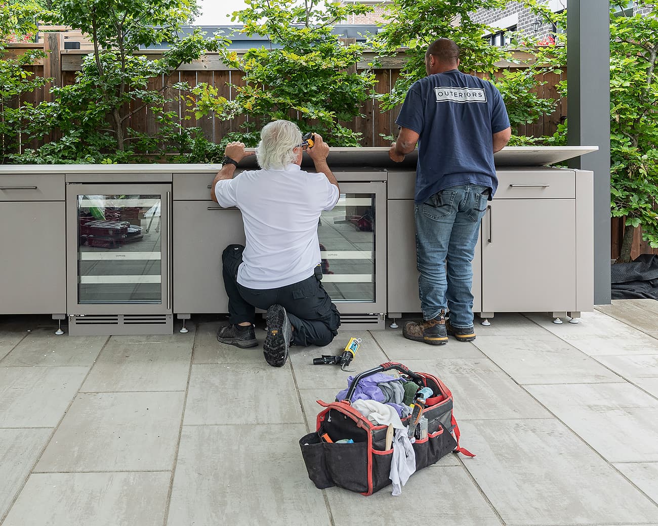 Outeriors install team putting countertop into place