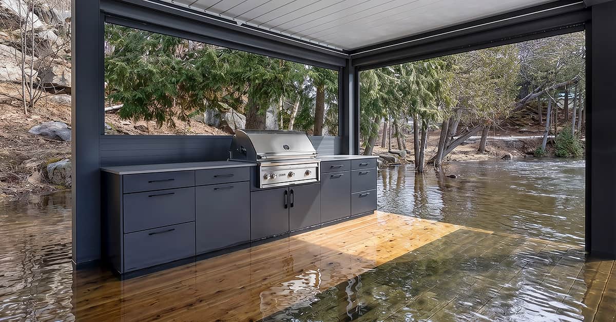 Alumina waterproof aluminum outdoor kitchen cabinets on a cottage country dock in early spring with water visible at the deck edge