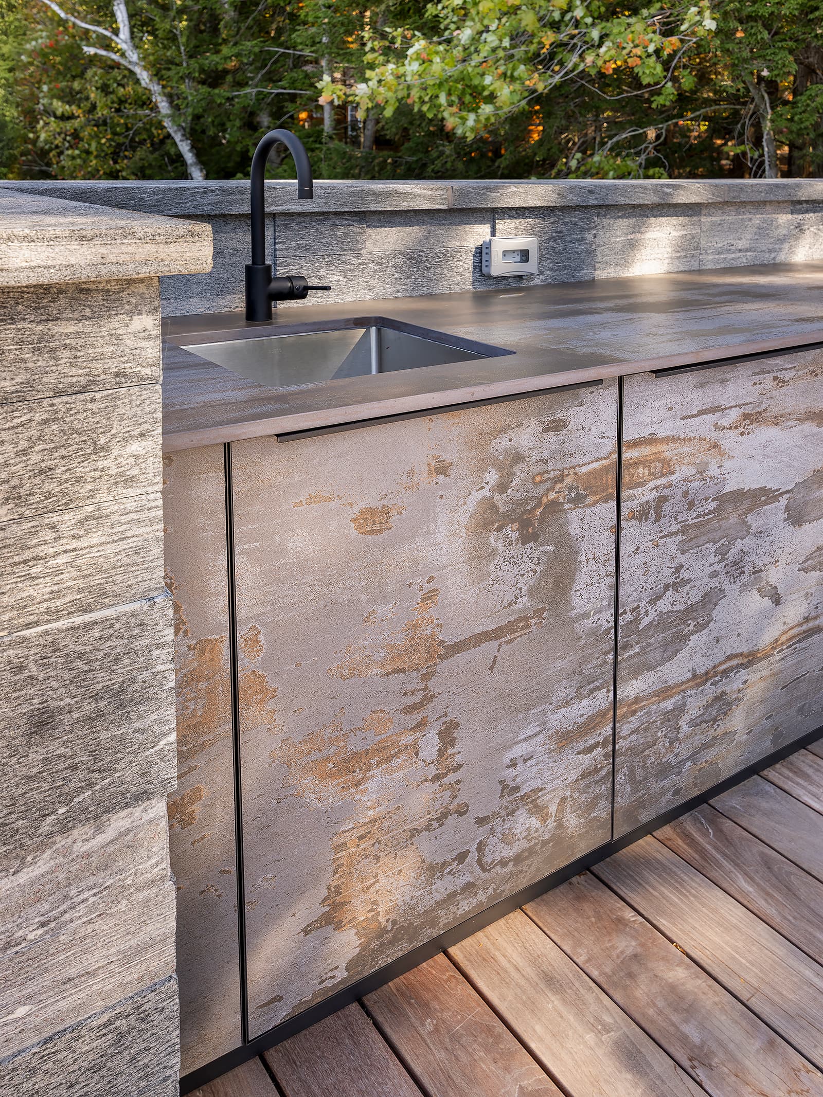 Cabinetry and sink with hidden appliances.