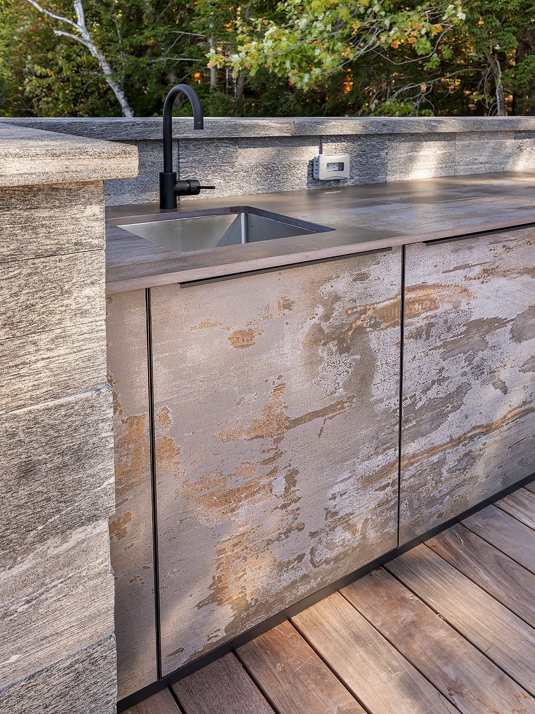 Cabinetry and sink with hidden appliances.