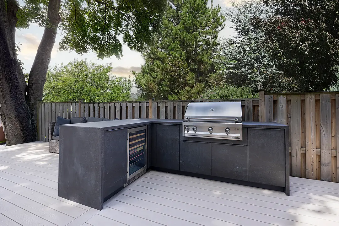 l-shape outdoor kitchen in backyard