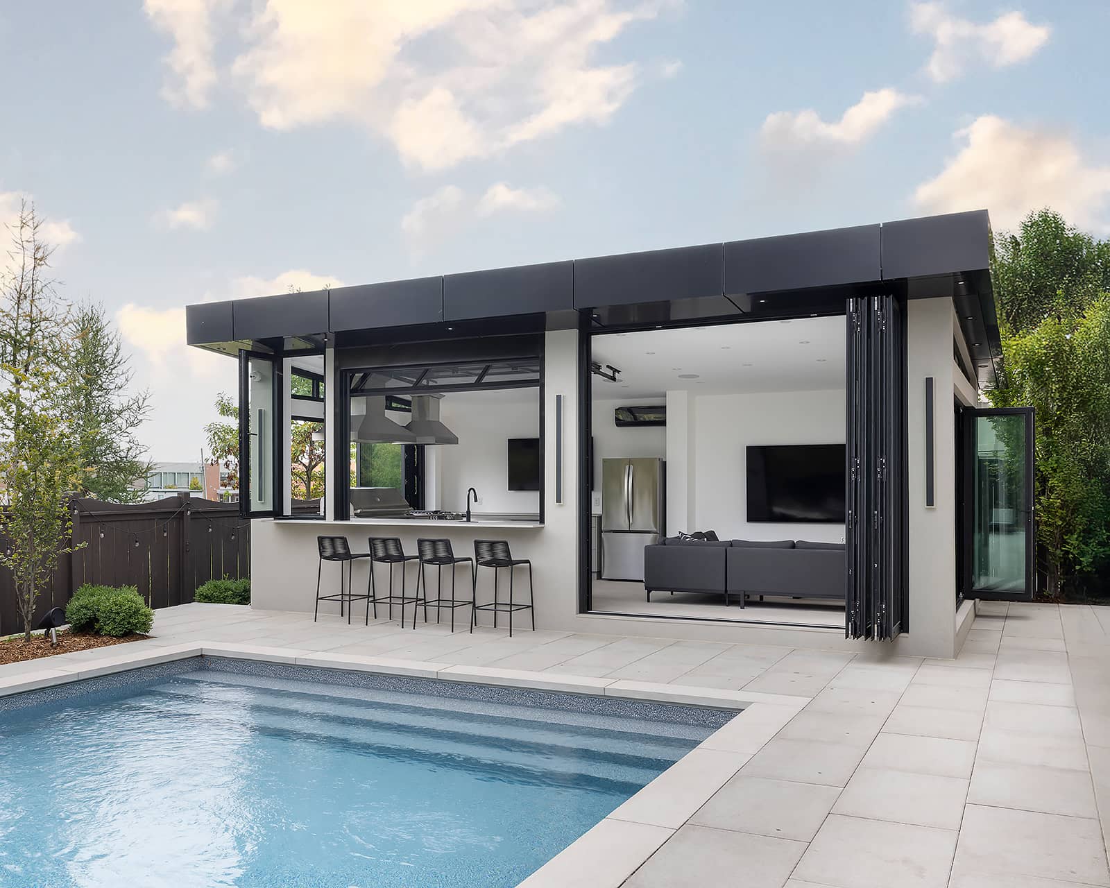 Wide shot of backyard with pool and cabana