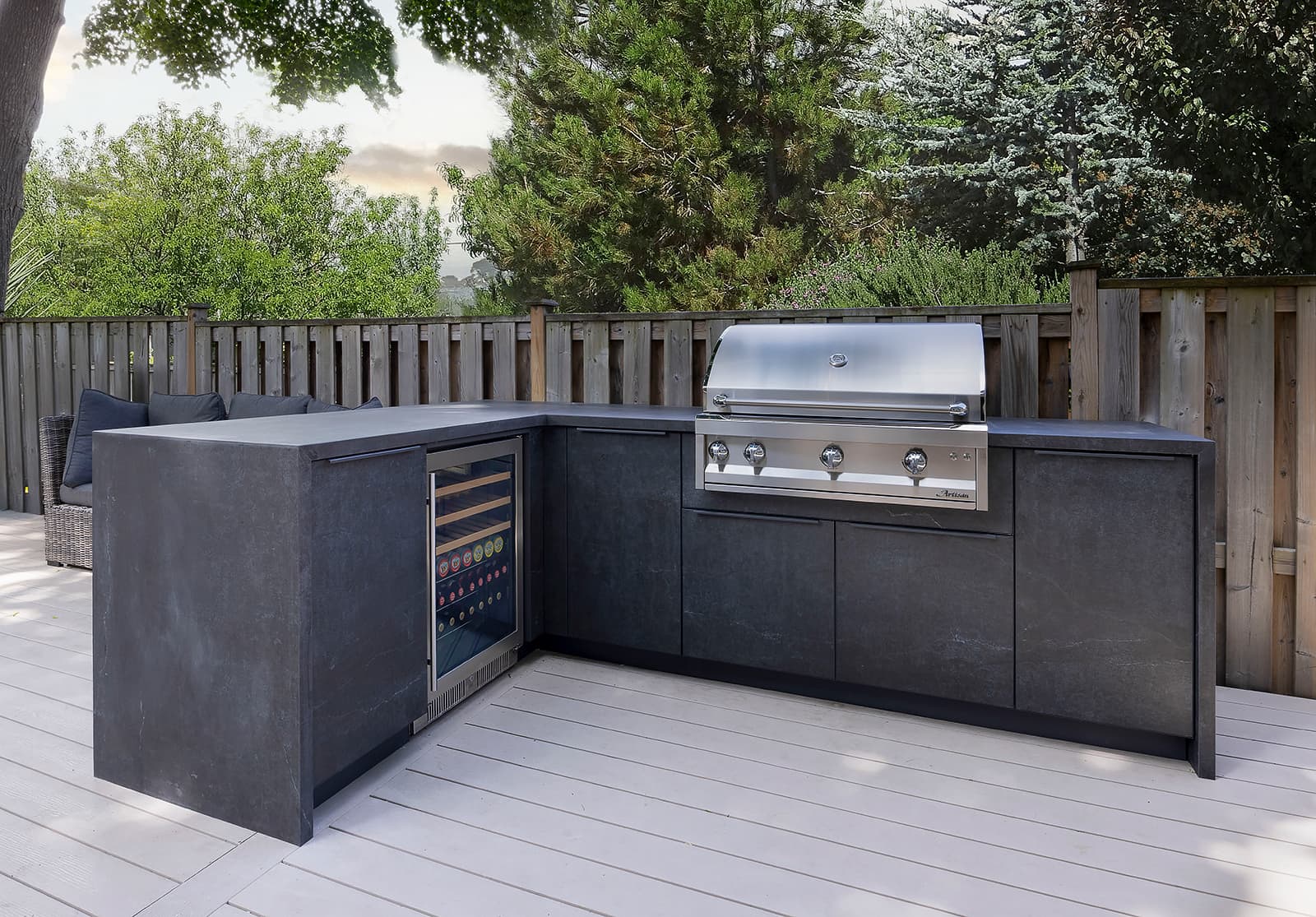 L-shape outdoor kitchen with Alumina AS cabinetry, Artisan grill, refrigerator