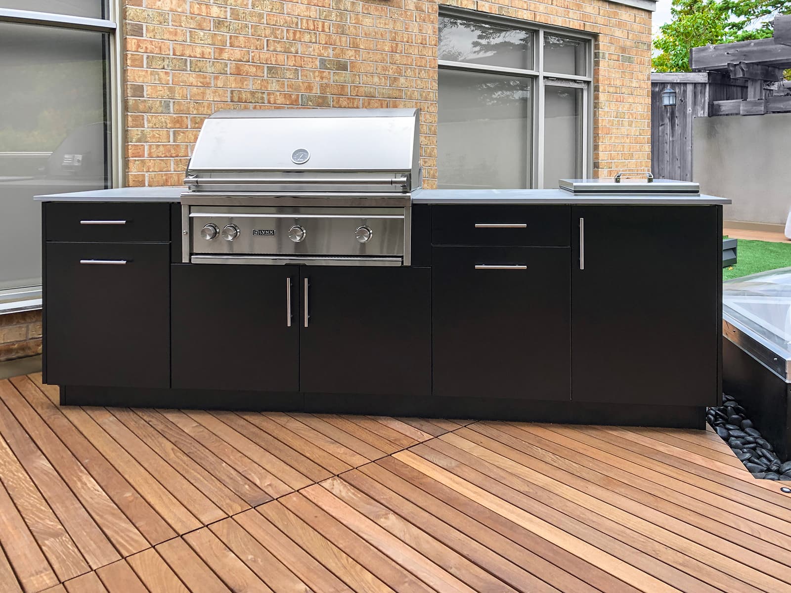 Alumina cabinetry in black with a sink