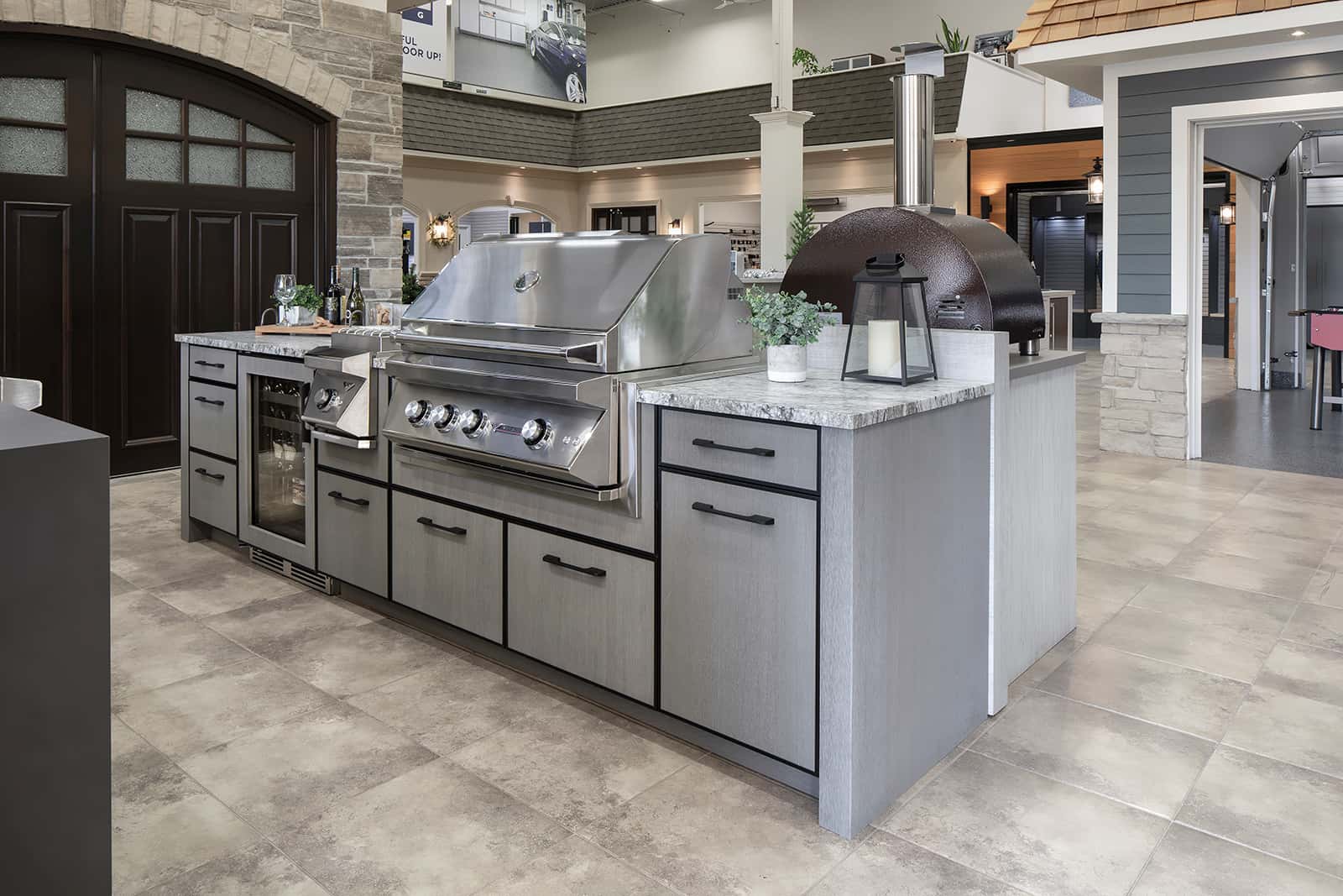 bar fridge and grill in cabinetry at Outeriors showroom