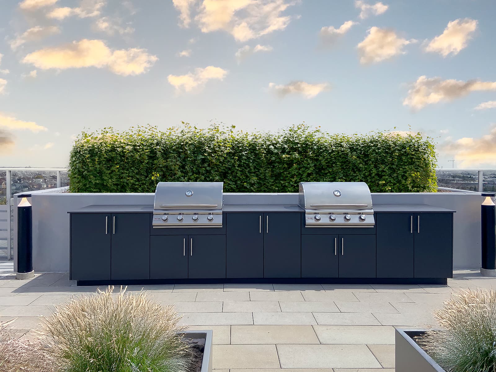 Luxury rooftop terrace with custom outdoor kitchen and city skyline view