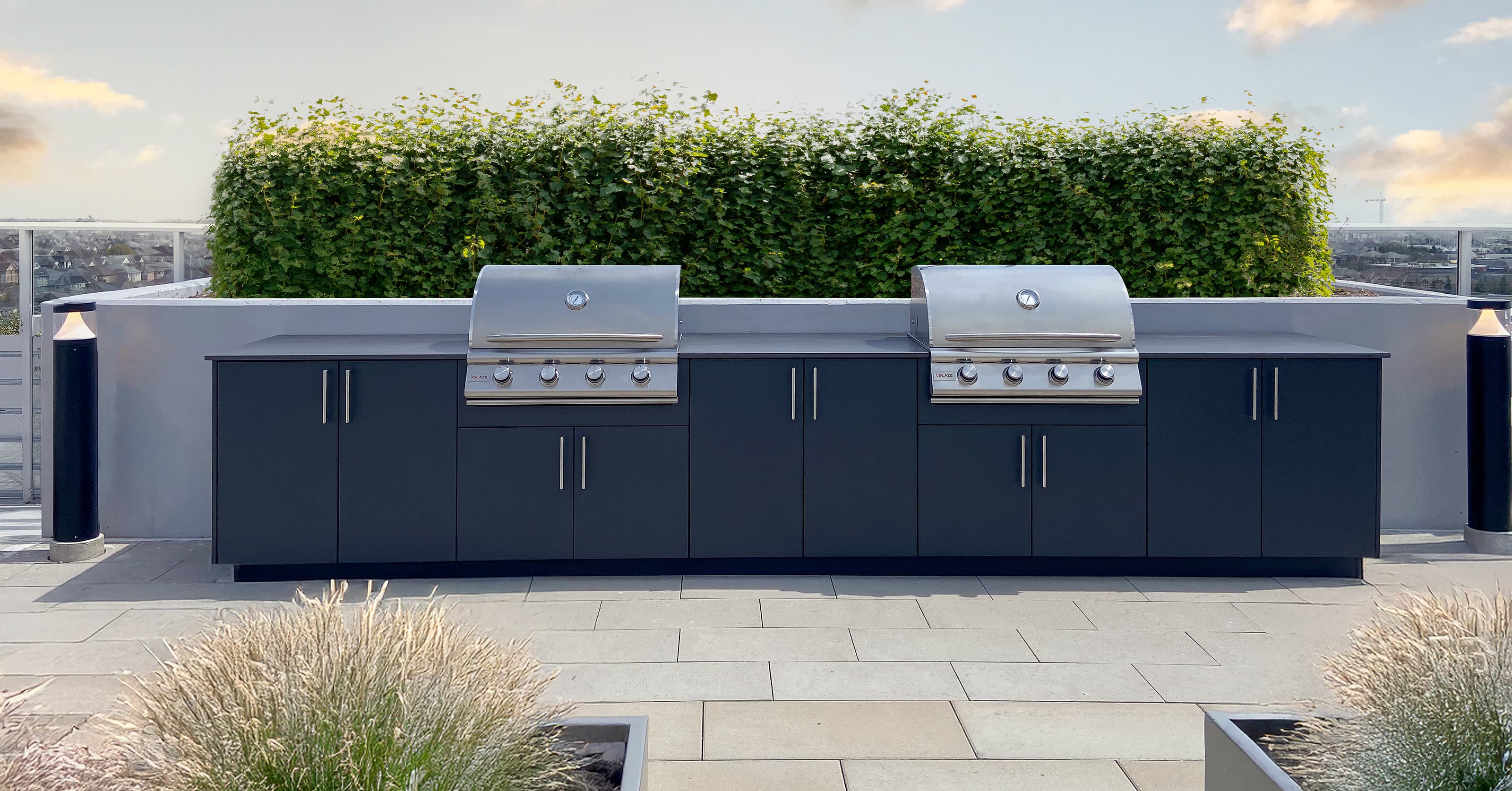 Luxury rooftop terrace with custom outdoor kitchen and city skyline view