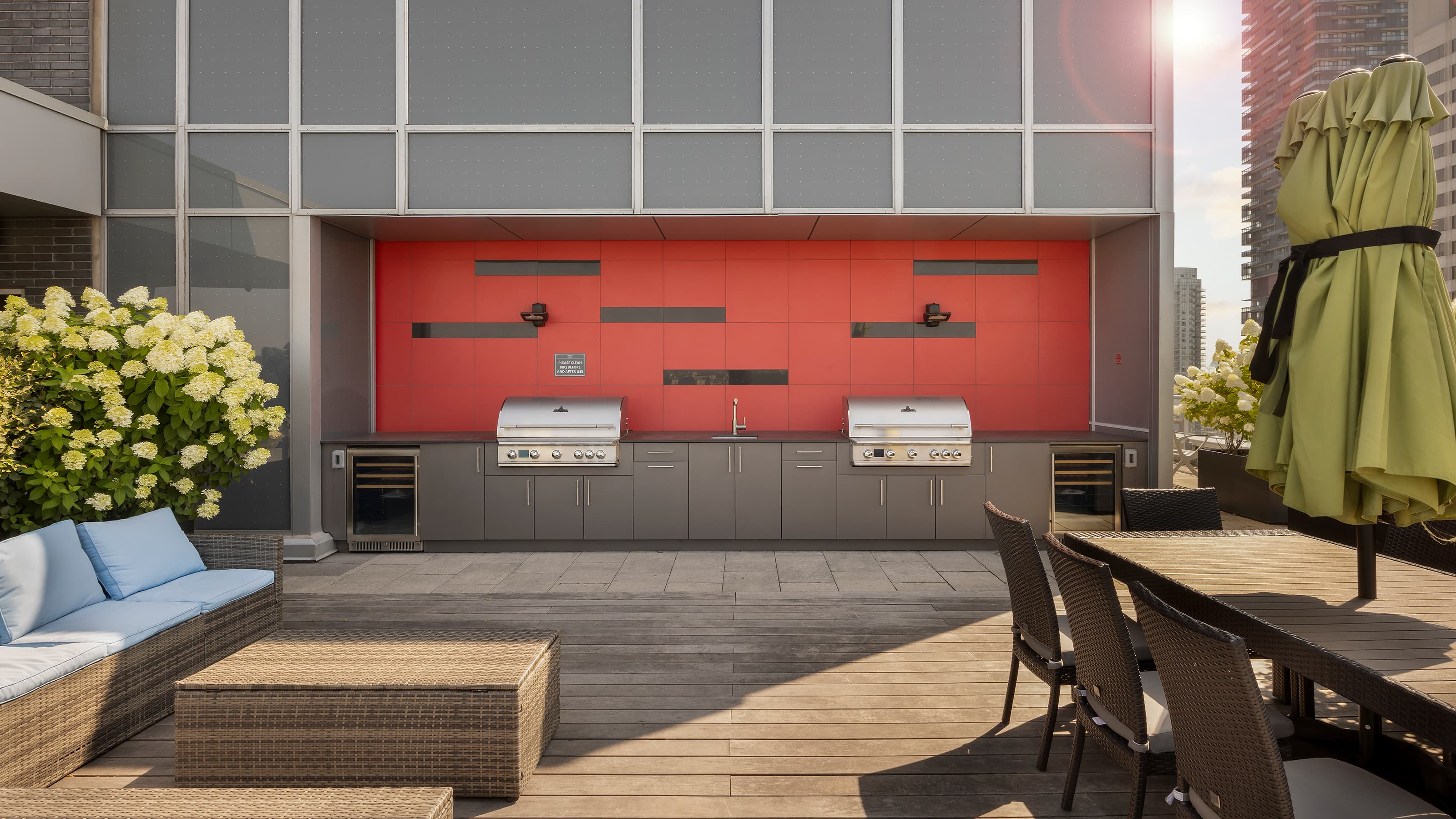 Luxury rooftop terrace with custom outdoor kitchen and city skyline view