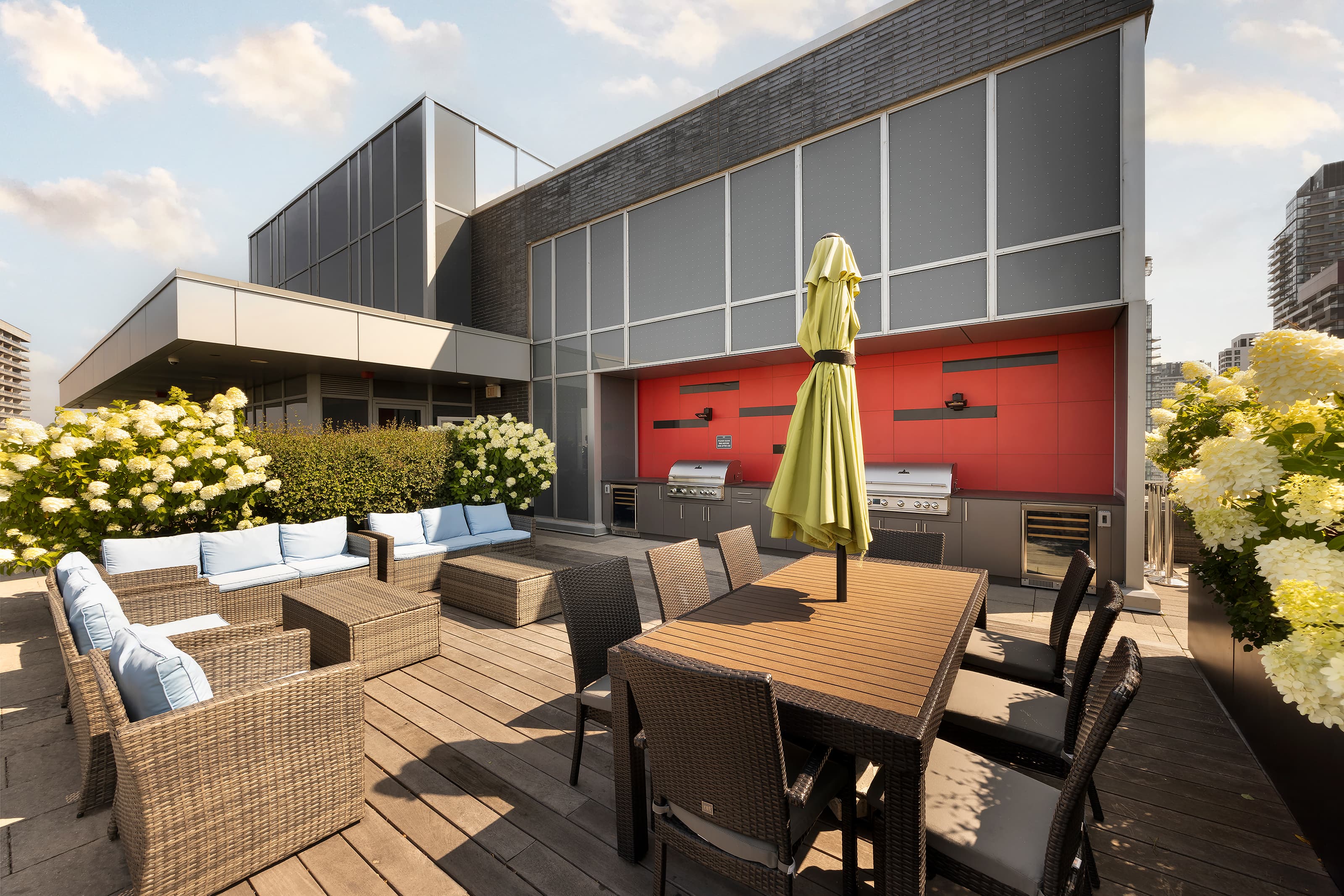 Luxury rooftop terrace with custom outdoor kitchen and city skyline view