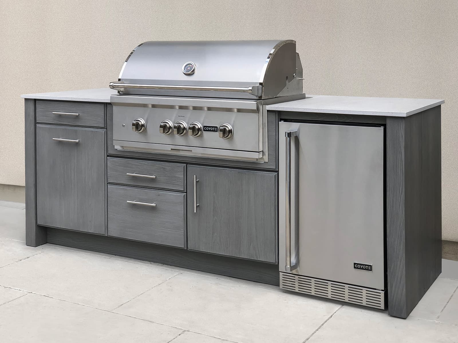 NatureKast cabinetry with Coyote grill and fridge