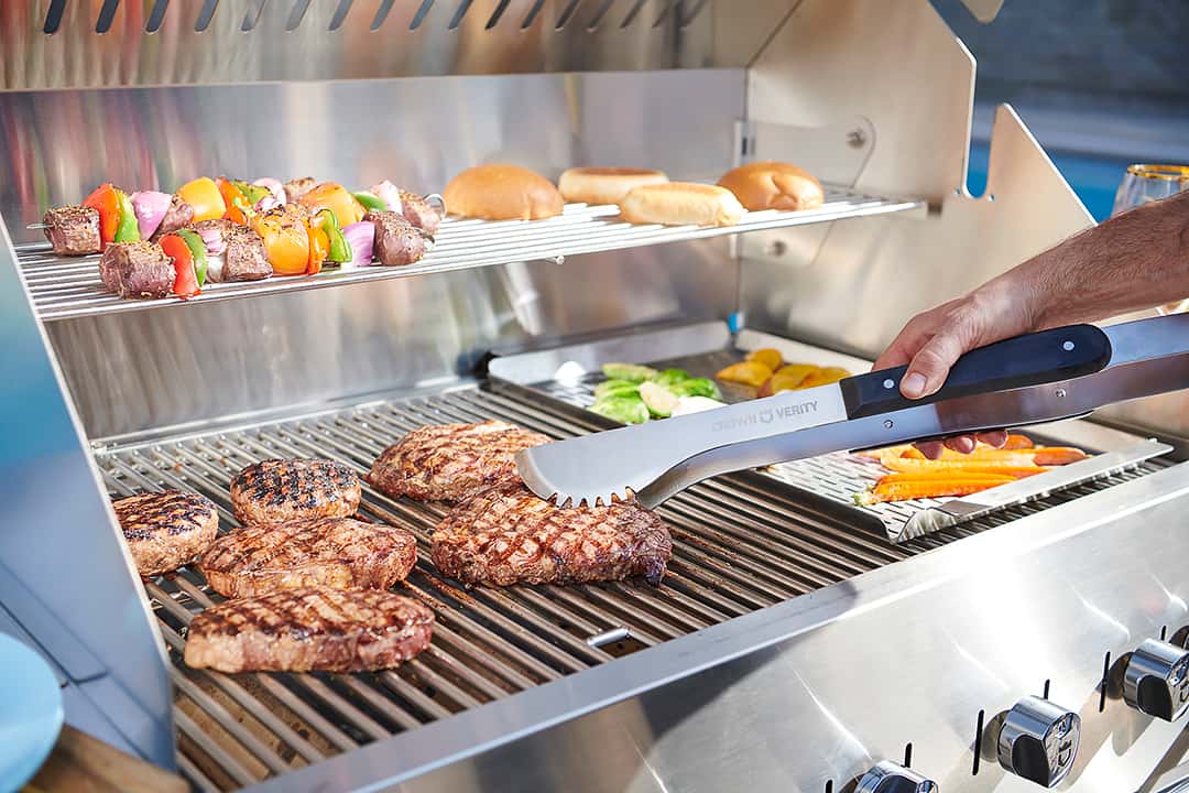 steaks and kabobs on hot grill outdoors